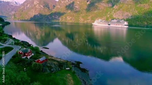 A cruise ship sailing on a fjord in Norway - aerial view photo