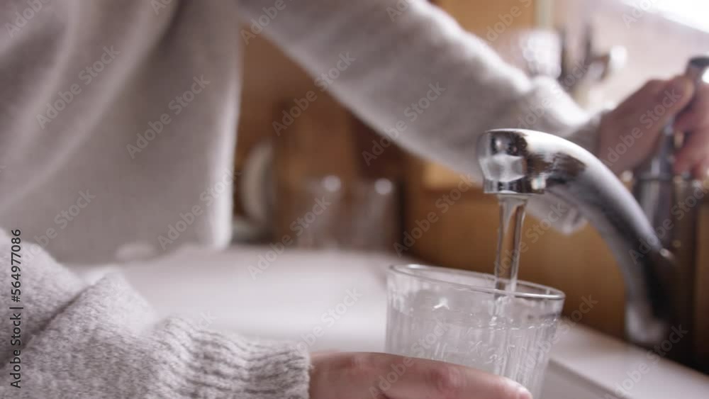 Cosy and stylish interior of treehouse cabin in the woods. pouring cup of water. Cosy and stylish interior of treehouse cabin in the woods. pouring cup of water.