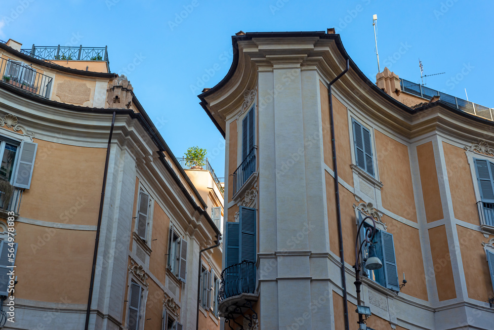 Part of a townhouse on a sunny day in Rome. Windows, facades, building, architecture.