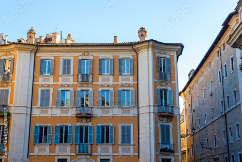 Obraz na płótnie Part of a townhouse on a sunny day in Rome. Windows, facades, building, architecture. w salonie
