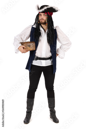 A pirate of the Caribbean in a suit is standing stands and holds a small treasure chest.. Male figure isolated on white background.