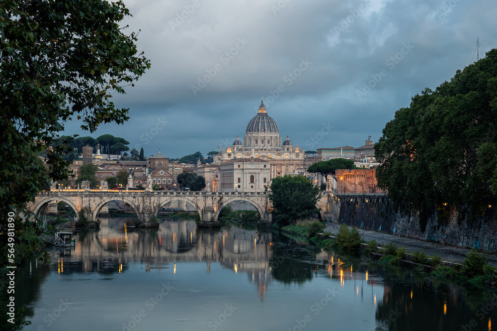 Fototapeta premium Beautiful colorful morning view of Rome Skyline with the famous Vatican Saint Peter Basilica and Saint Angelo Bridge above Tiber River in Rome, Italy.