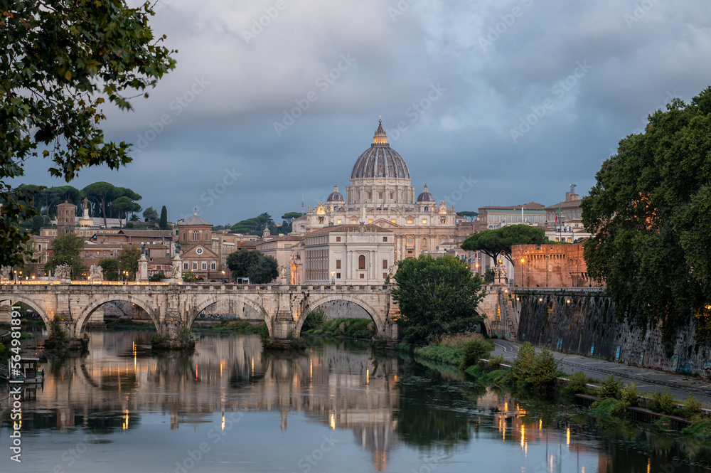 Beautiful colorful morning view of Rome Skyline with the famous Vatican Saint Peter Basilica and Saint Angelo Bridge above Tiber River in Rome, Italy.