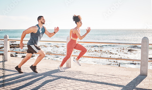Runner, fitness and sea with a sports couple outdoor during summer for cardio or endurance exercise. Health, training and ocean with a man and woman running on a promenade for a workout together