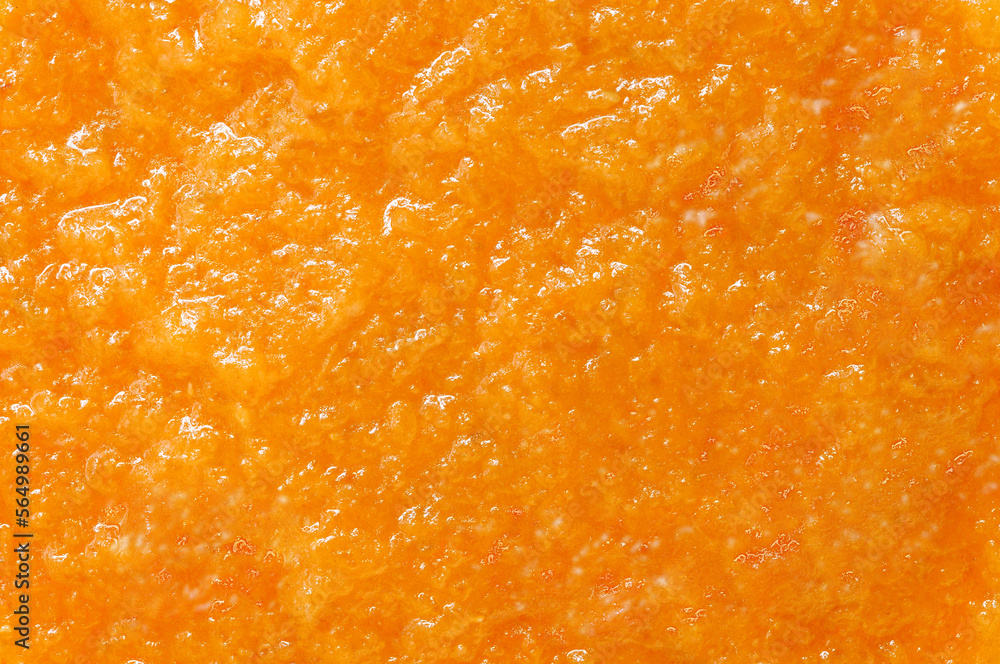 Orange jam, background uniform texture, close-up macro top view Orange jam, background uniform texture, close-up macro top view