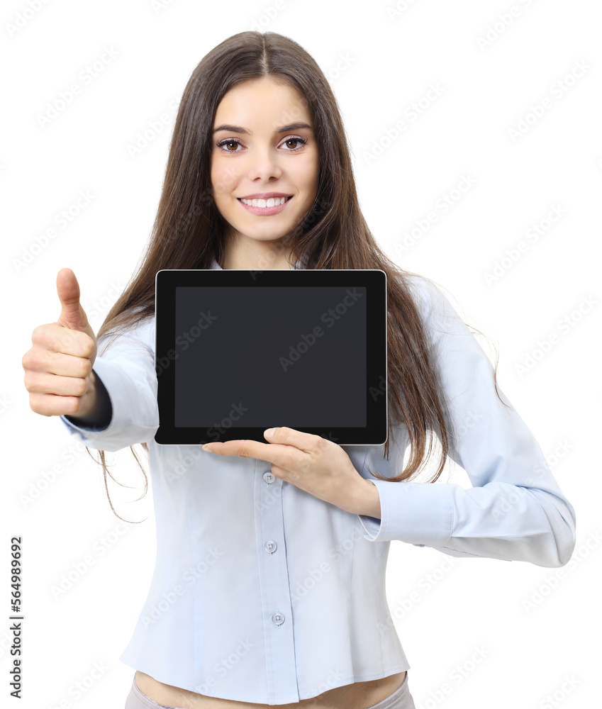smiling young woman shows digital tablet, holds notebook with blank display in one hand and makes like gesture with other hand in foreground smiling young woman shows digital tablet, holds notebook with blank display in one hand and makes like gesture with other hand in foreground
