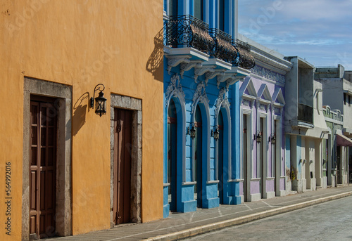 Exterior view of colorful historical old town buildings in the downtown of M  rida  the capital of the Mexican state of Yucat  n. Colonial neighborhood street with traditional Mexican architecture. 