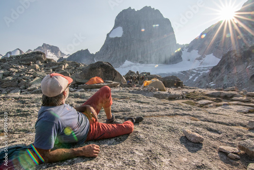 Resting mountain climber in Bugaboo Mountains, British Columbia, Canada