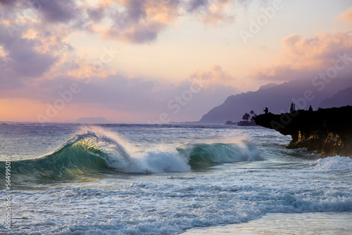 Wave in sea at sunrise, Pounders Beach, Oahu, Hawaii, USA