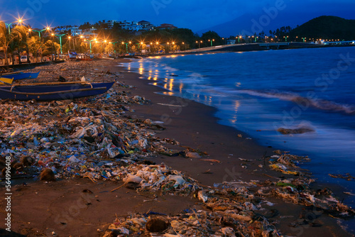 Trash on beach at night, Legazpi City, Albay Province, Philippines photo