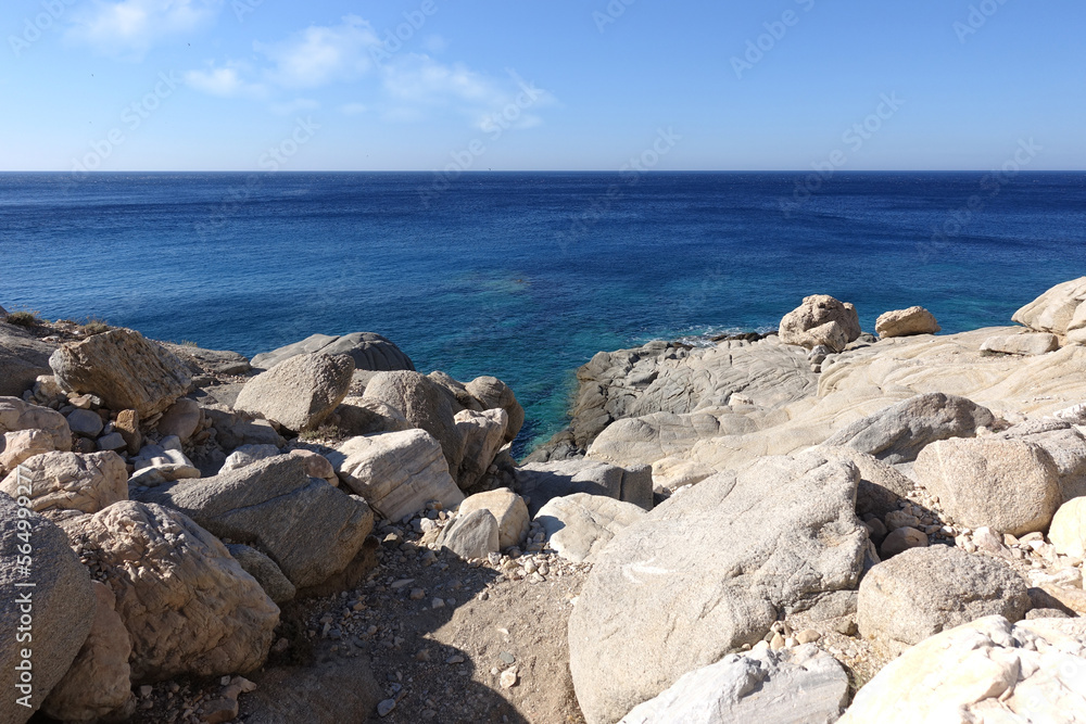 White rocky bay forming natural shadow and beautiful pebble beach in exotic Caribbean island White rocky bay forming natural shadow and beautiful pebble beach in exotic Caribbean island