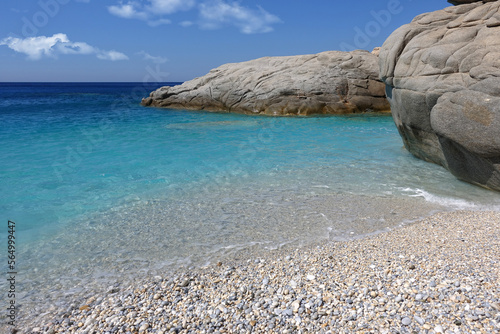 Beautiful paradise turquoise pebble beach of Seychelles in island of Ikaria, North Aegean sea, Greece photo