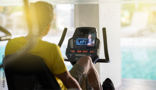 A man exercise by climber in fitness center in the morning. photo