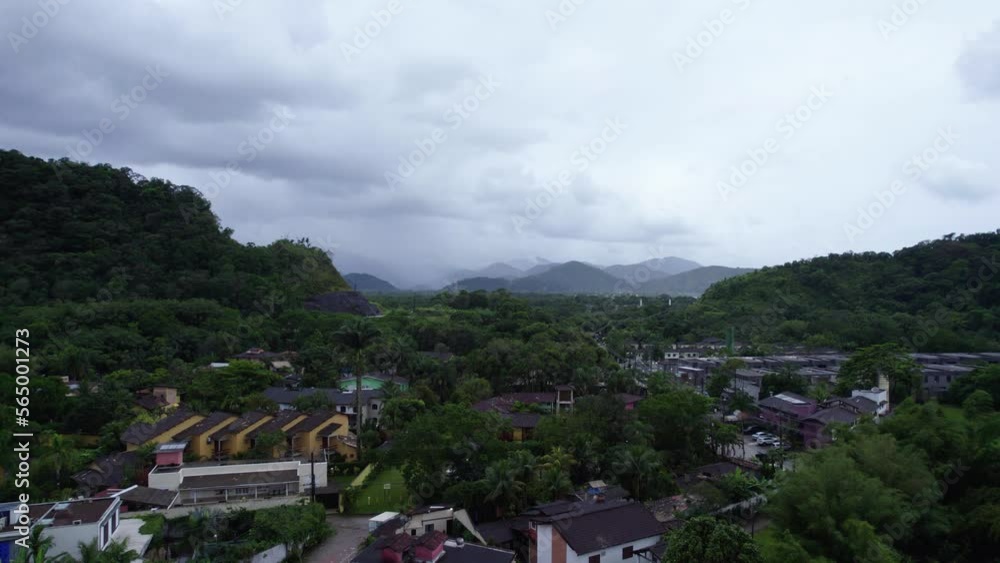 Aerial view rising over the Barra Do Sahy town, in cloudy Saint Sebastian, Brazil Aerial view rising over the Barra Do Sahy town, in cloudy Saint Sebastian, Brazil
