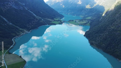 Oldevatnet glacier lake  in Norway with green water, reflection of clouds and mountains in it. Drone footage photo