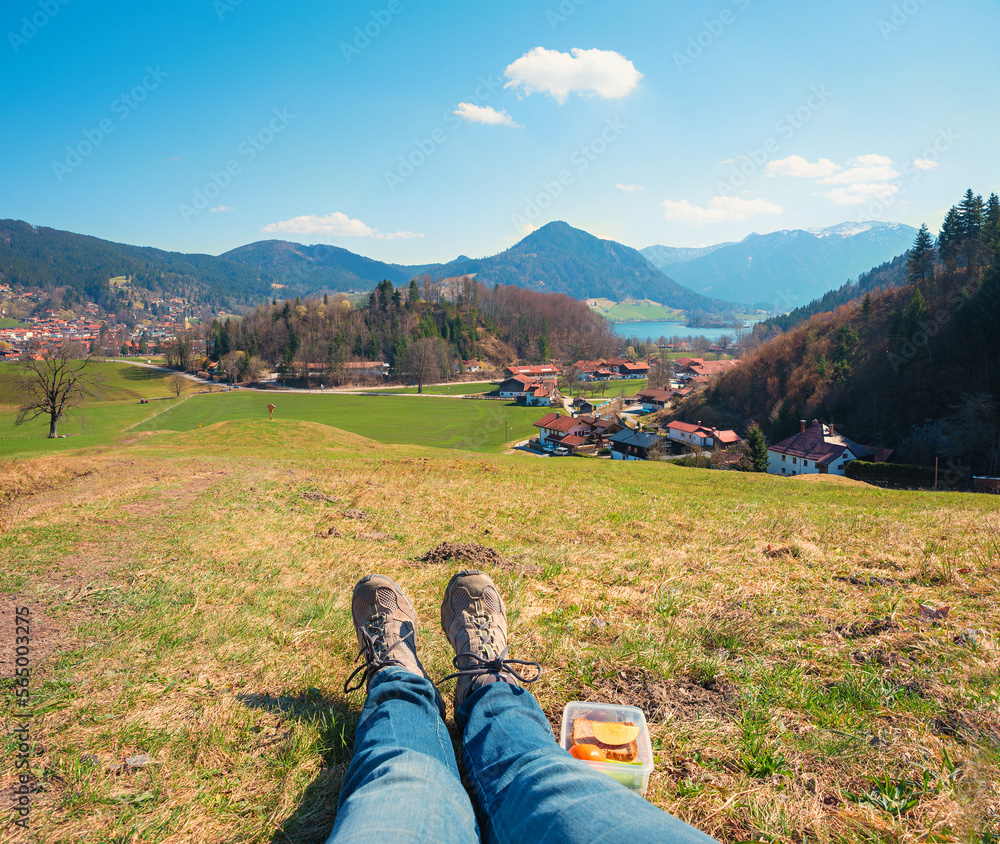 snack break along the hiking trail above Schliersee tourist resort, view to the lake and alps snack break along the hiking trail above Schliersee tourist resort, view to the lake and alps