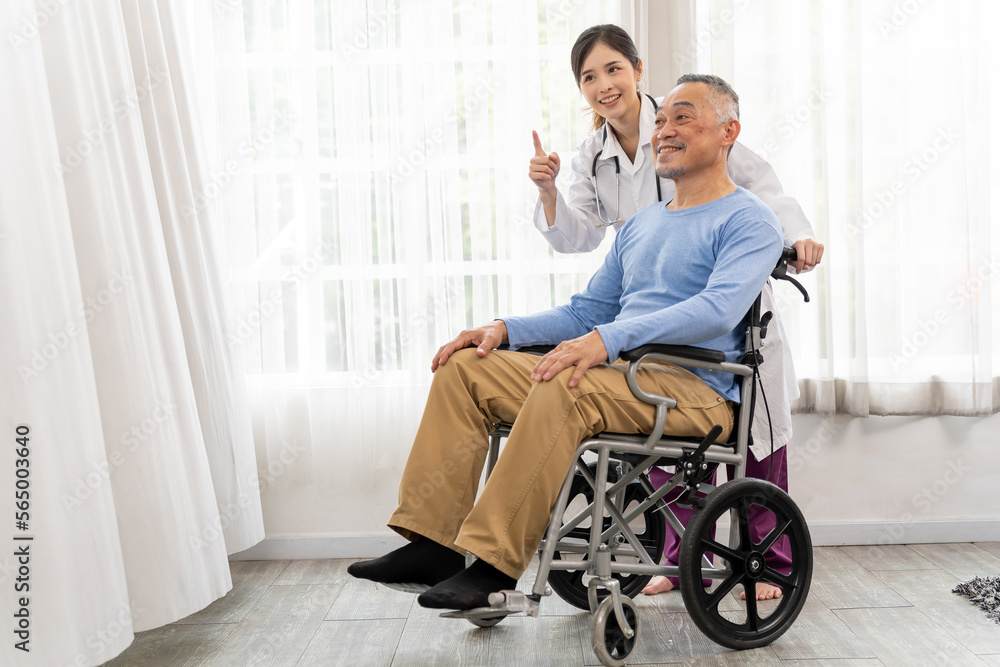 Young female doctor talking with old man in wheelchair to encourage Young female doctor talking with old man in wheelchair to encourage