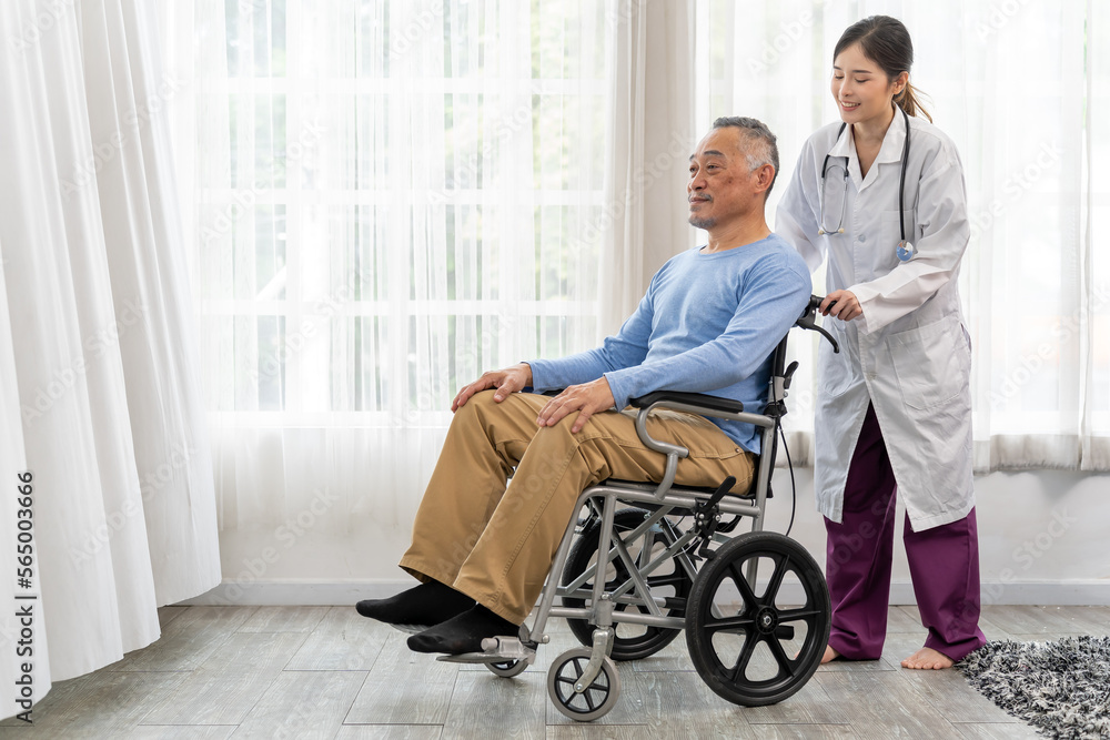 Young female doctor talking with old man in wheelchair to encourage Young female doctor talking with old man in wheelchair to encourage