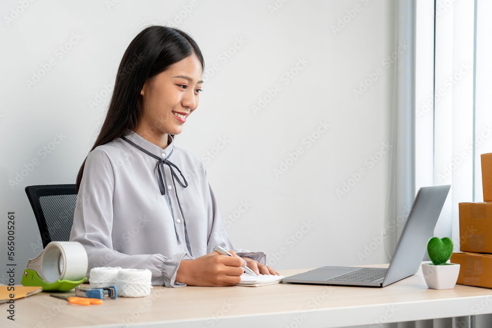 Woman entrepreneur working at home receive orders from online customers and check data while preparing to pack products deliver sending to the client Woman entrepreneur working at home receive orders from online customers and check data while preparing to pack products deliver sending to the client