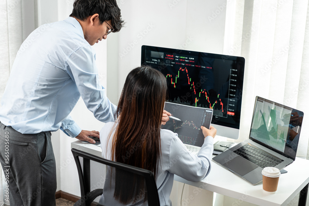 Investor business team working with computer, tablet and analyzing graph stock market trading planning with chart data financial investment planning