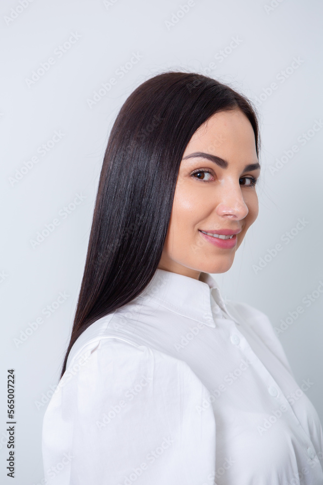 Beautiful young woman with long black hair in a beauty salon. Beautiful young woman with long black hair in a beauty salon.