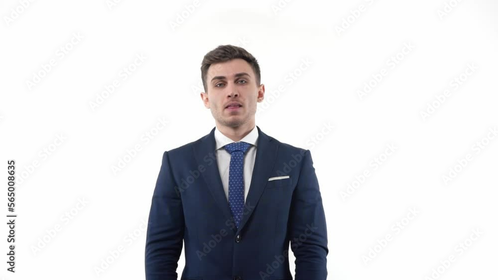 Handsome male businessman in a suit is thinking with neutral emotions. In the studio on a white background. Handsome male businessman in a suit is thinking with neutral emotions. In the studio on a white background.