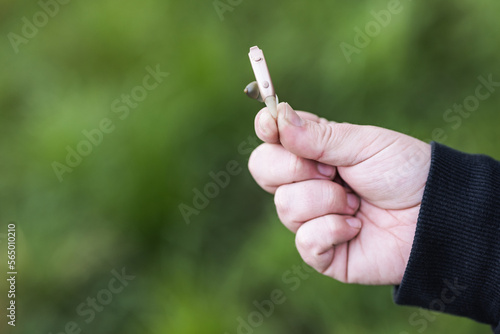 man's hand holding a hearing aid for the deaf © 23_stockphotography