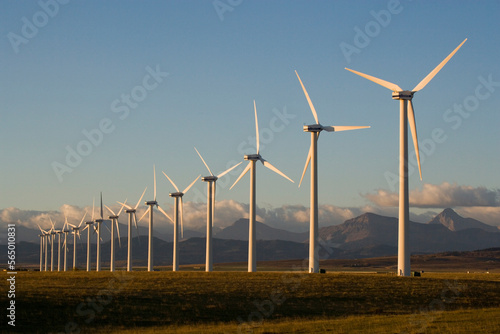 Windmills used for power generation at sunrise, near Pincher Creek, Alberta, Canada. photo