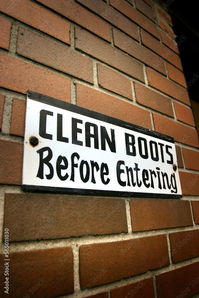 Warning sign outside a soccer locker room. Warning sign outside a soccer locker room.