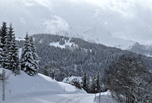 Snow covered alpine landscape in Villars, Switzerland photo