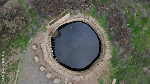 Natural water pool spring, Ein Mokesh, Israel, drone pulling away aerial view photo