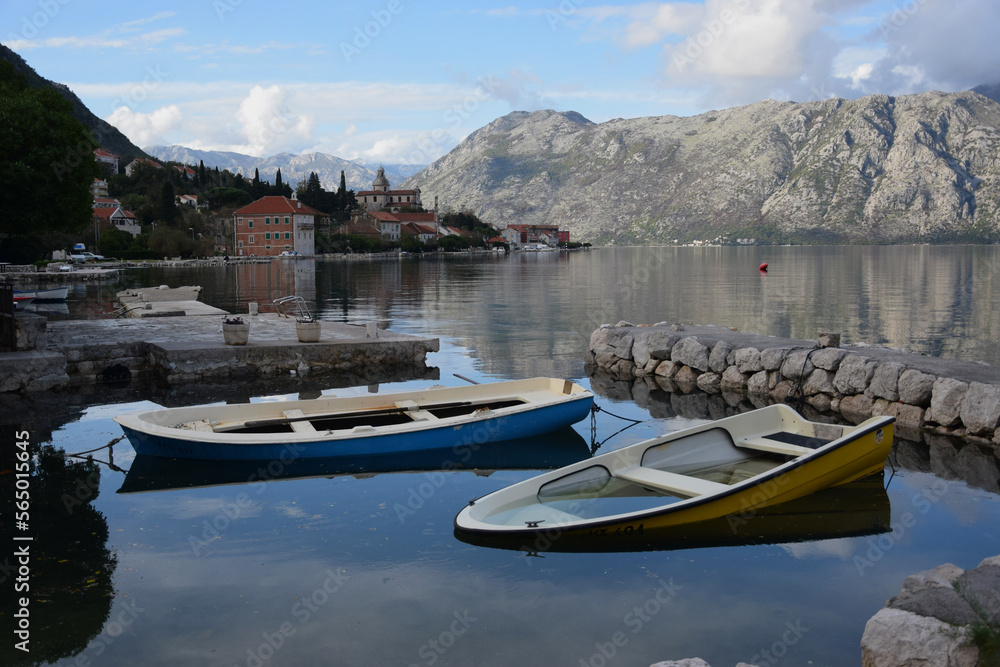 Naklejka premium Bay of Kotor,view of the Adriatic sea and mountains, mirror reflection of the sky and mountains in sea. For the magazine and advertising. Montenegro
