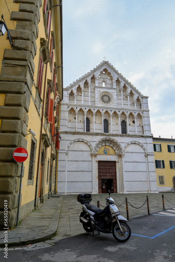 December 2022 Pisa, Italy: Church Chiesa di Santa Caterina d'Alessandria and city street 