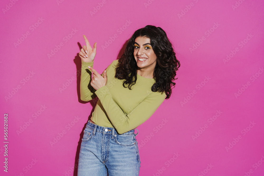Young beautiful caucasian long-haired curly happy woman looking at camera Young beautiful caucasian long-haired curly happy woman looking at camera