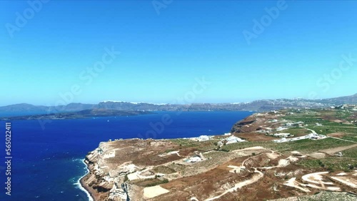 Aerial 4K Blue Sea and Sky Top View Over Akra Mavro Vouno in Santorini Greece photo