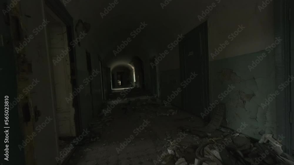 Walking through old dark hallway in decay Walking through old dark hallway in decay