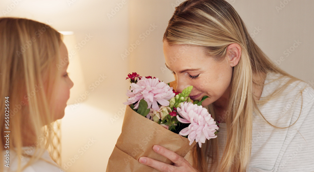 Flowers, gift and happy with mother and girl for mothers day, birthday or congratulations in family home. Gratitude, smile and love with child giving bouquet to mom for present and celebration