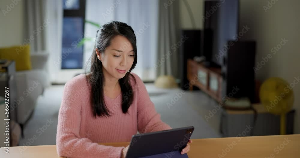 Woman use of tablet computer at home Woman use of tablet computer at home