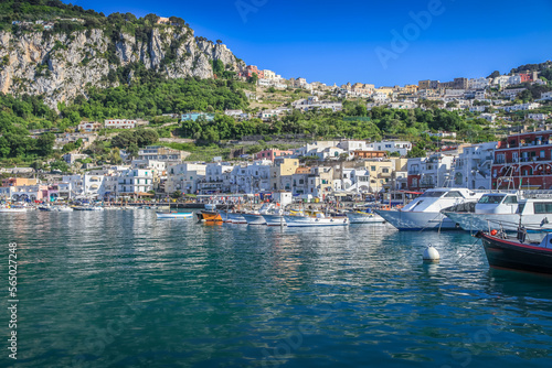 Capri city cliffs and marina with boats and yacht, amalfi coast, Italy