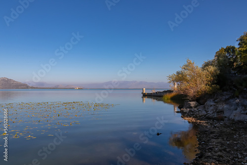 Panoramic view from the lakeshore of Lake Skadar National Park in autumn seen from Godinje, Bar, Montenegro, Balkans, Europe. Stunning travel destination in Dinaric Alps near Albanian border. Hiking photo