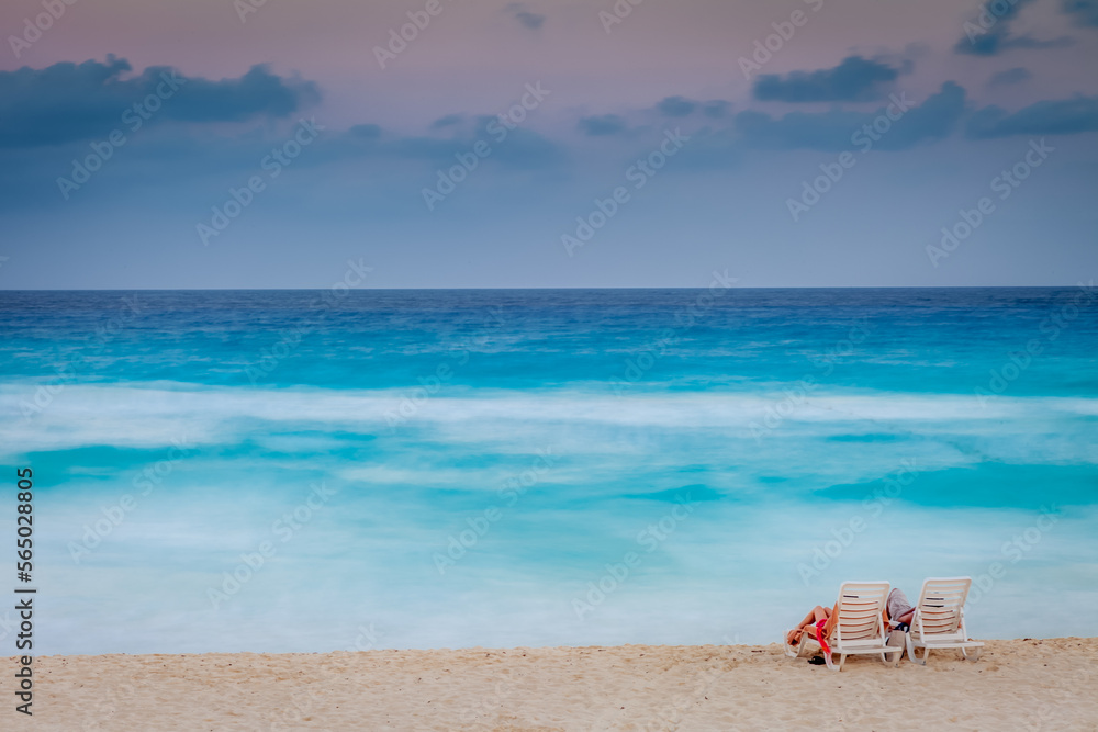 Romantic Couple Vacation on the beach, Viewing Caribbean Sea in Cancun, Mexico