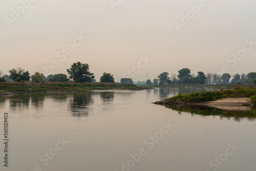 Early morning on the river Elbe near Pretzsch Saxony Germany. Beautiful bends of the river. Green trees . little mist