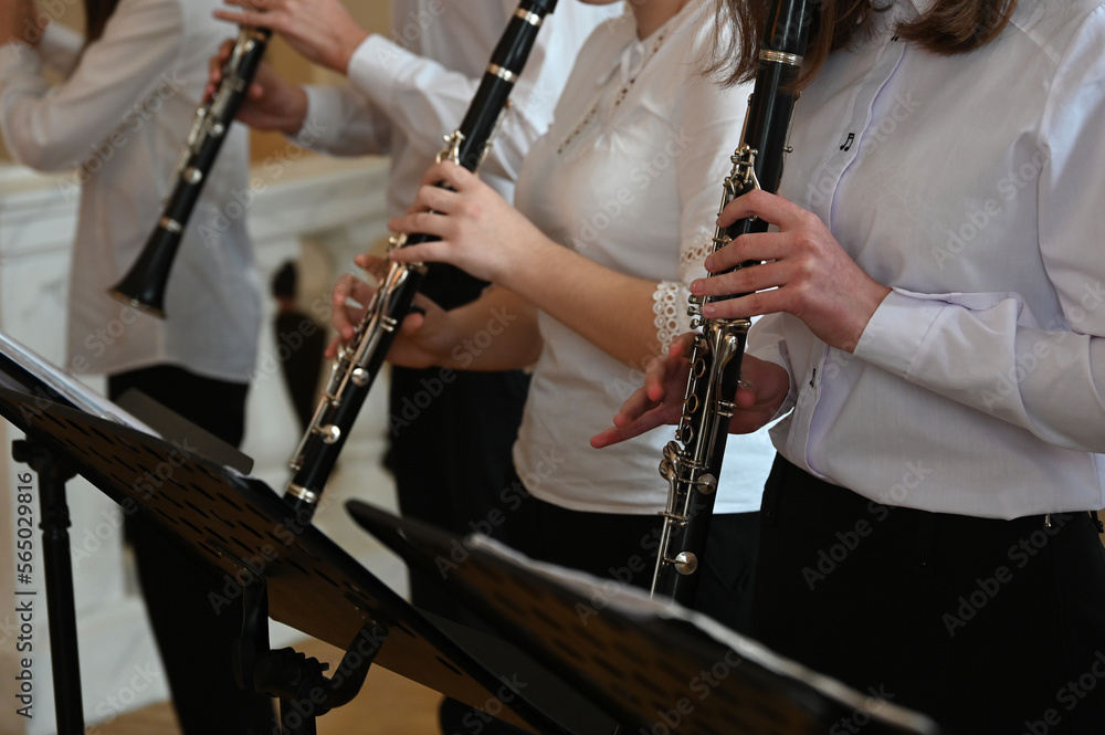 Fototapeta premium orchestra musicians playing flutes close-up