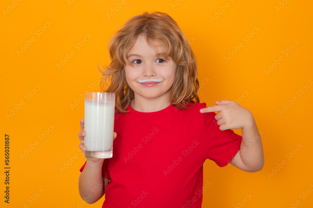 Healthy food for kids. Organic milk. Cute little child with glass of milk on studio color background. Kid with milk moustache. Fun portrait of cute kid with white milk mustache and funny face. Healthy food for kids. Organic milk. Cute little child with glass of milk on studio color background. Kid with milk moustache. Fun portrait of cute kid with white milk mustache and funny face.