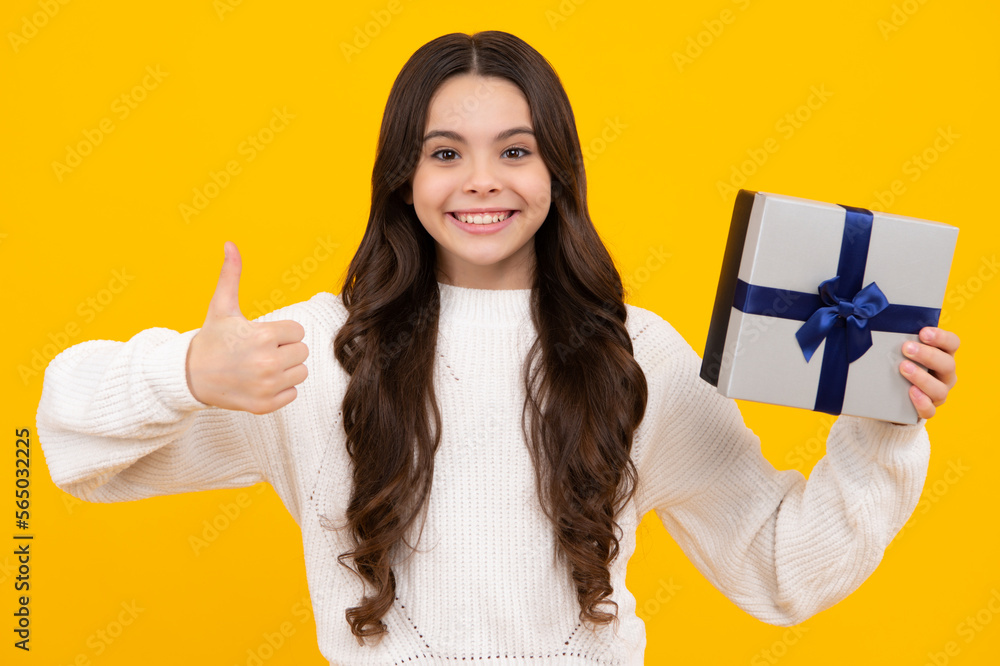 Cute teenager child girl congratulate with valentines day, giving romantic gift box. Present, greeting and gifting birthday concept. Happy face, positive and smiling emotions of teenager girl. Cute teenager child girl congratulate with valentines day, giving romantic gift box. Present, greeting and gifting birthday concept. Happy face, positive and smiling emotions of teenager girl.