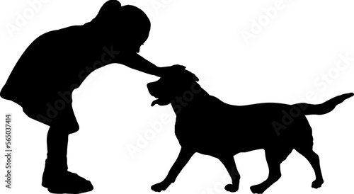 Silhouette of a girl stroking her pet - a dog.