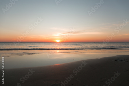 Calm sea with sunset sky with cloud.