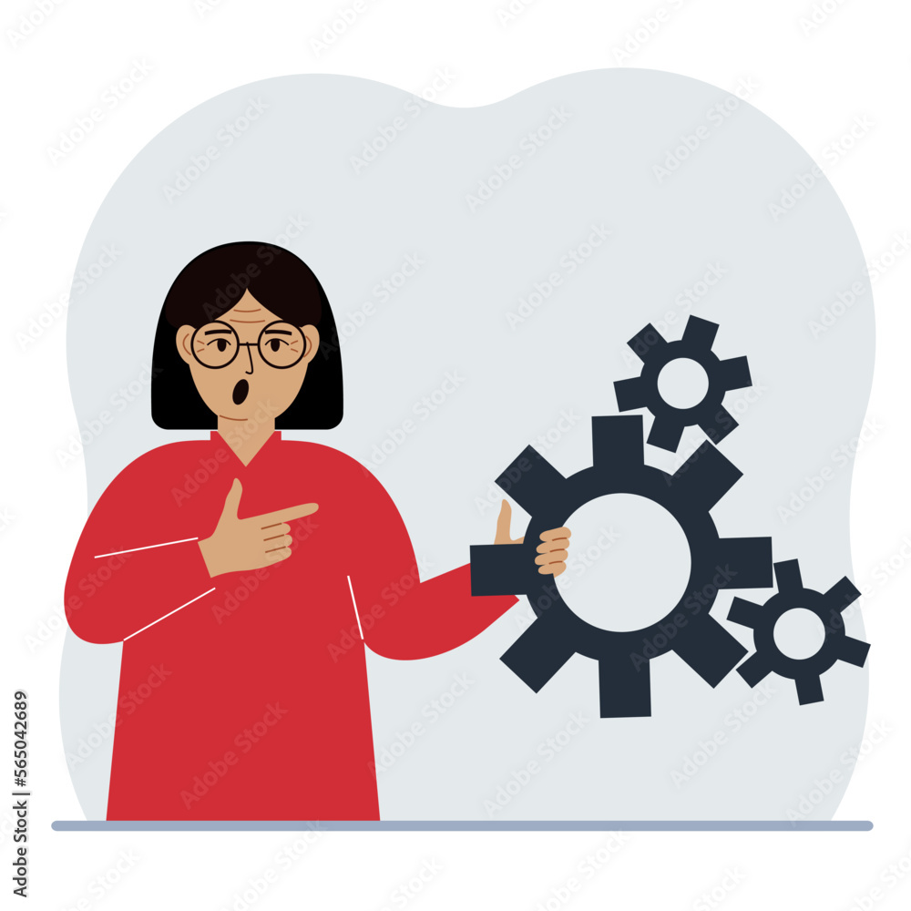 A woman holds gears in his hand. Points a finger at the cogwheels. The concept of financial planning, movement, life, education or maintenance. A woman holds gears in his hand. Points a finger at the cogwheels. The concept of financial planning, movement, life, education or maintenance.