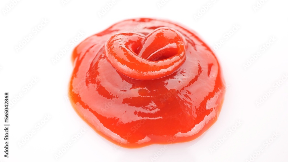 Squeezed ketchup on white plate close up Squeezed ketchup on white plate close up