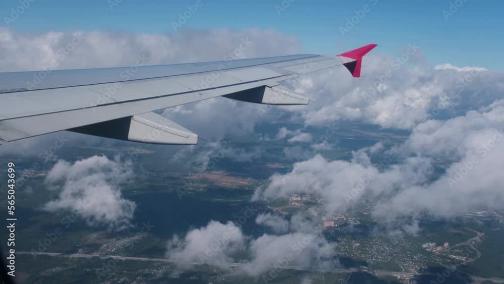 View of the white clouds and Earth from the airplane porthole. Travel concept. View of the white clouds and Earth from the airplane porthole. Travel concept.